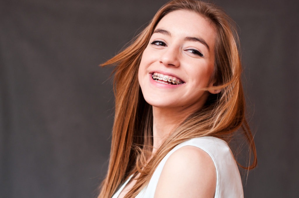 teen girl smiling with braces